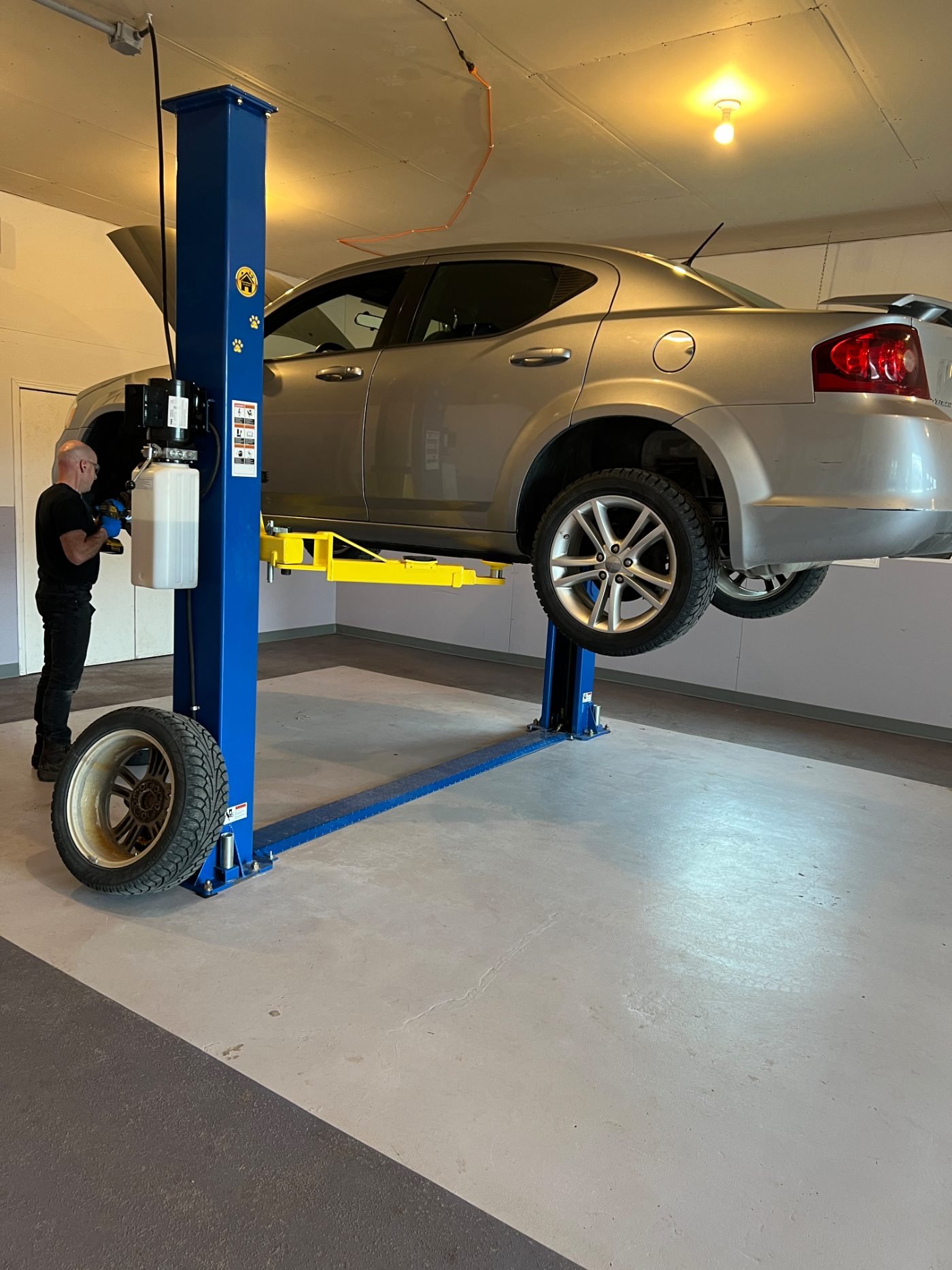Vehicle up on the lift in Allan's shop